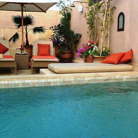 فندق رياض فيفا مراكش المظهر الخارجي الصورة A swimming pool in Morocco
